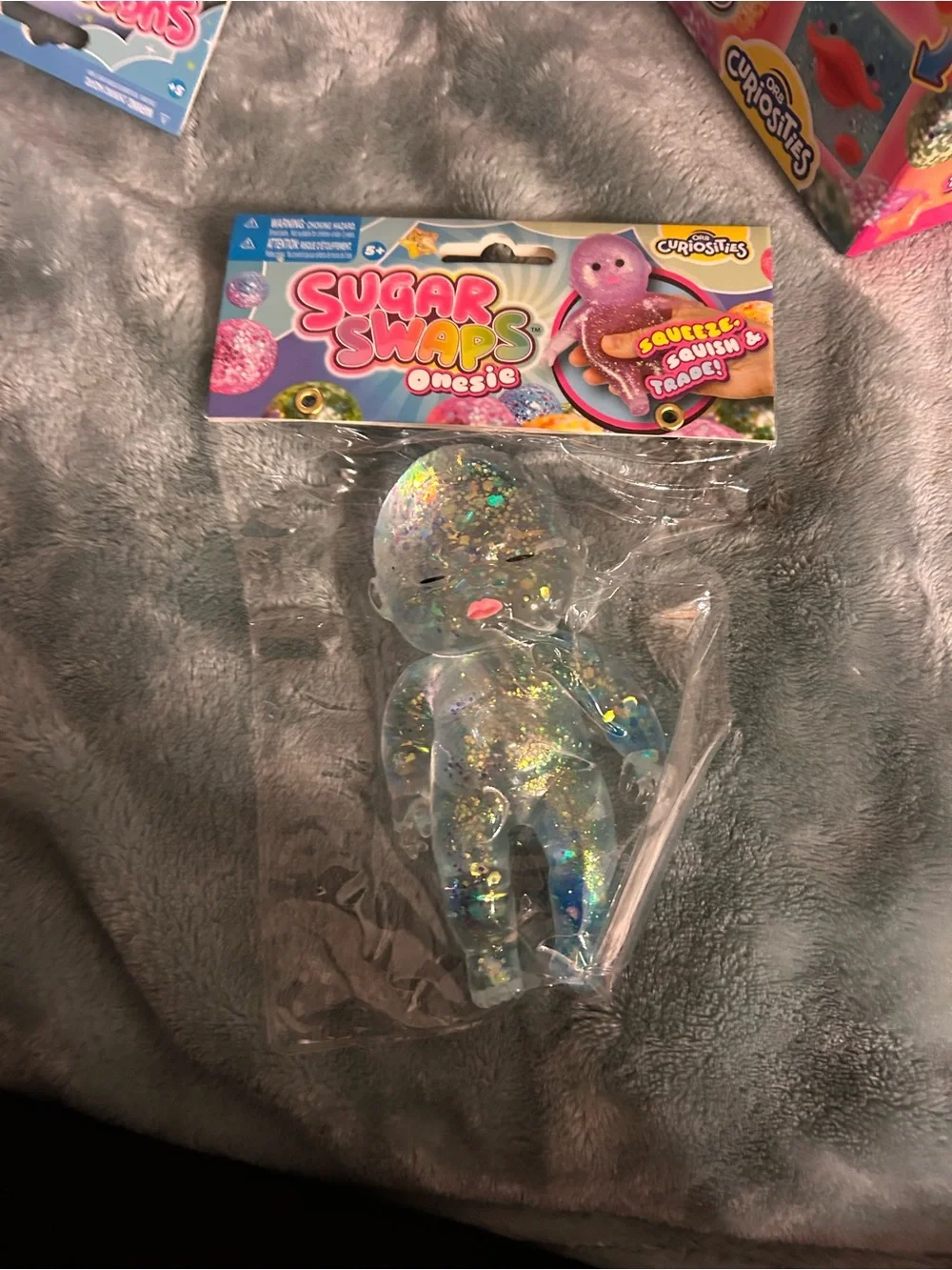 Sugar Swaps Opesie Glitter Clear Squishy Toy - Clear